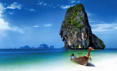 Thailand beach in tropical island. Travel boats at summer in sea